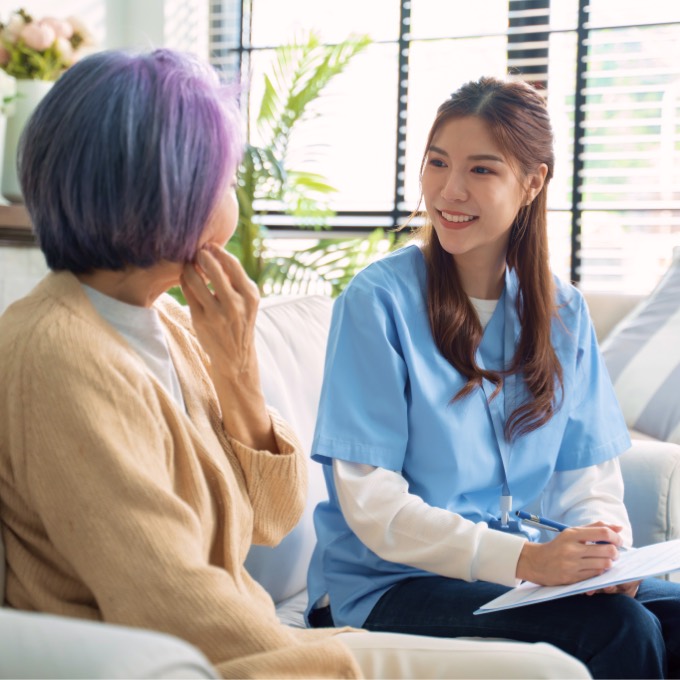 A Clever Care provider in conversation with a senior member