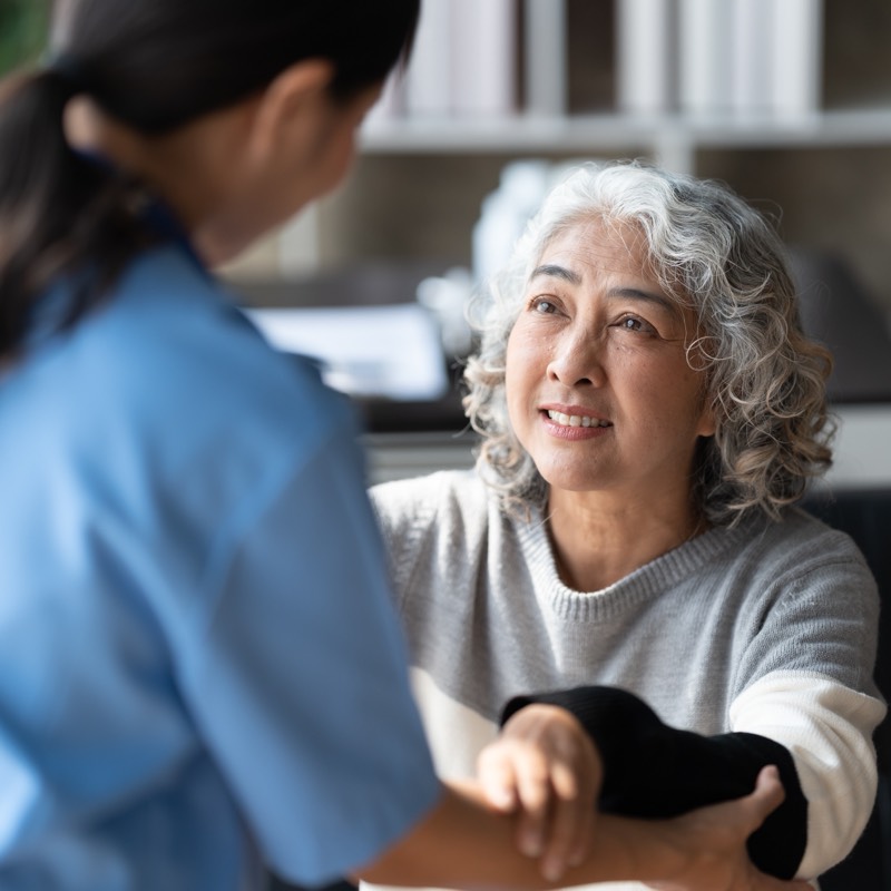 A Clever Care provider with a senior member during a visit